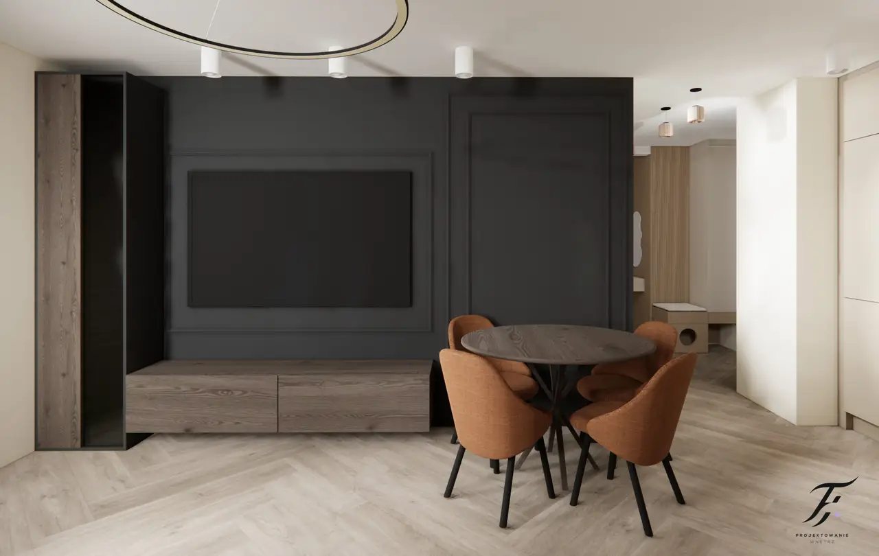 salon z antracytową ściana i rudymi krzesłami 